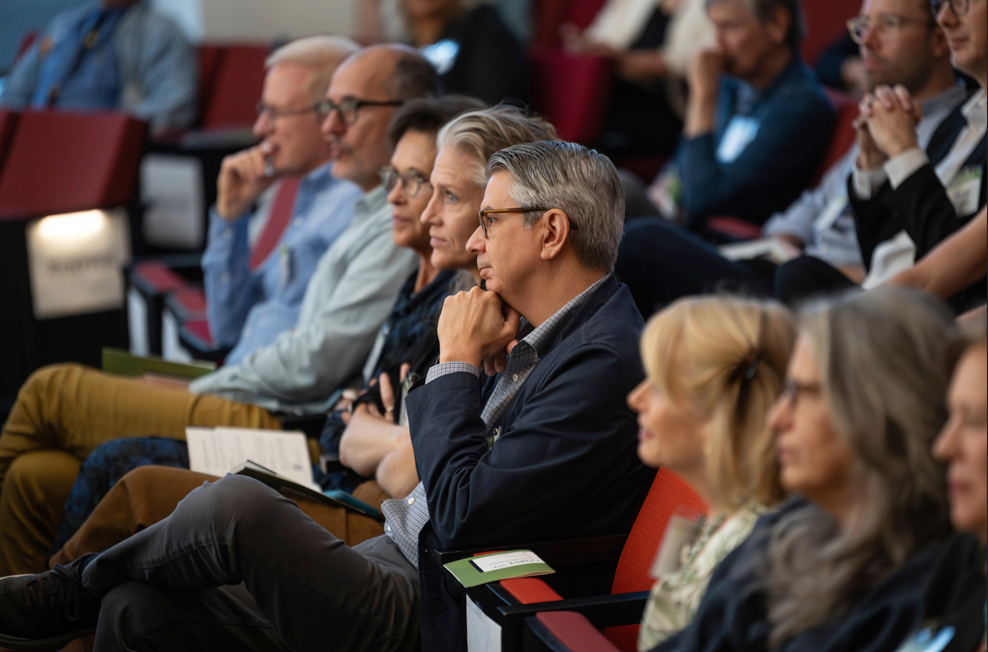 Audience members listening to the panel.